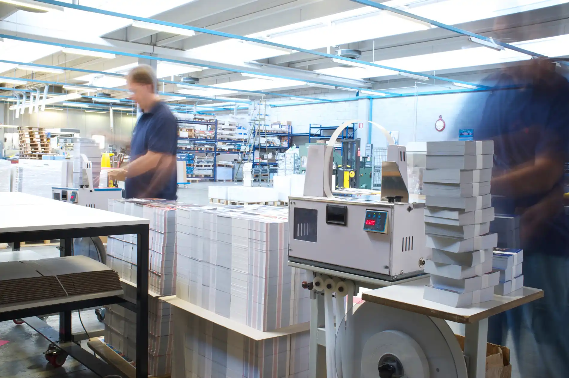 Houston printer working on book and booklet binding